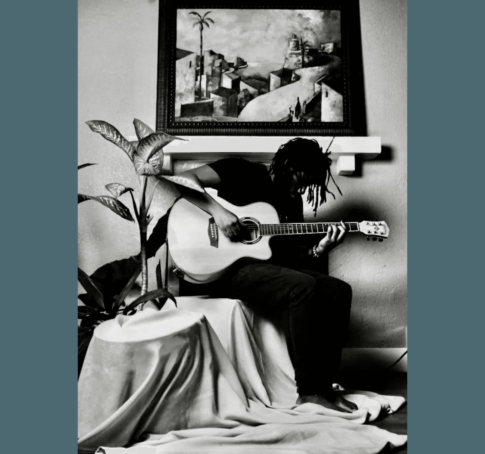Elder Charlot playing guitar