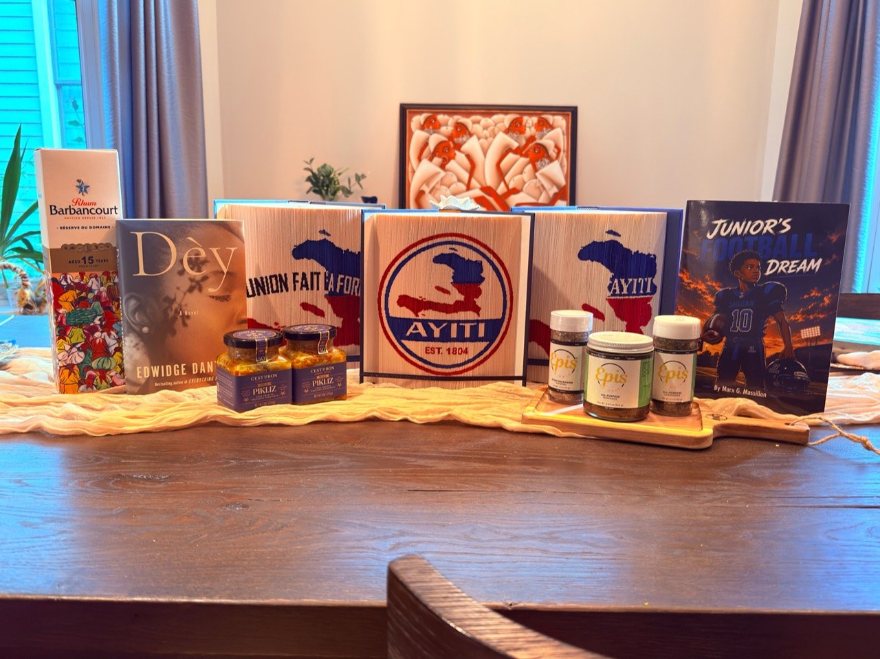 Haitian books, folded-book art and flavors arranged together on a table